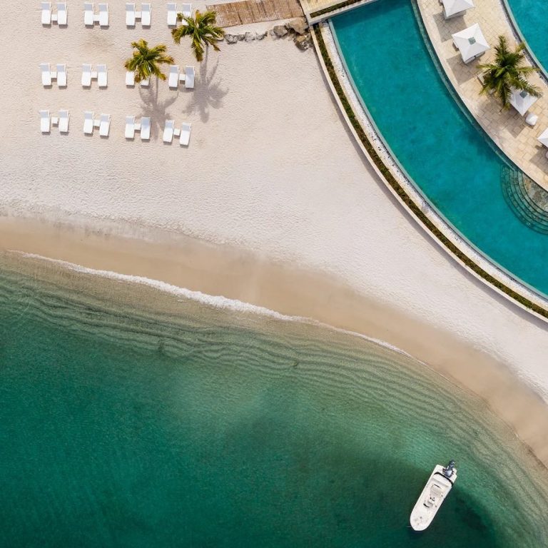 Caribbean Beach with white sand and stunning pool perfect for honeymooners